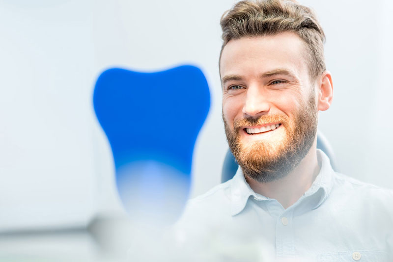 dental patient smiling after gum recession treatment